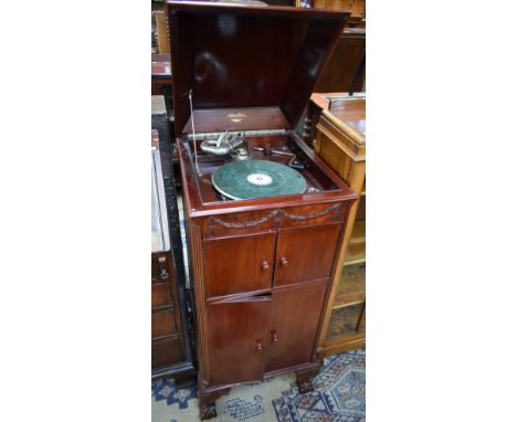 A floorstanding mahogany Natural Tone gramophone cabinet, retailed by William Whiteley Ltd, London, a Stroboscope 50 78rpm tu