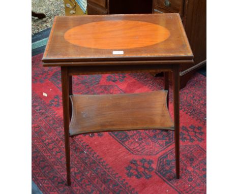 An Edwardian mahogany patience/card table, hinged rectangular top enclosing a baize lined playing surface, incurved rectangul