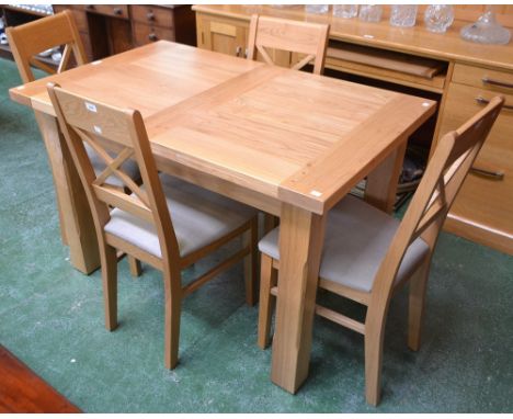 A contemporary light oak extending dining table, extends to 164.5cm; a set of four conforming dining chairs (5)