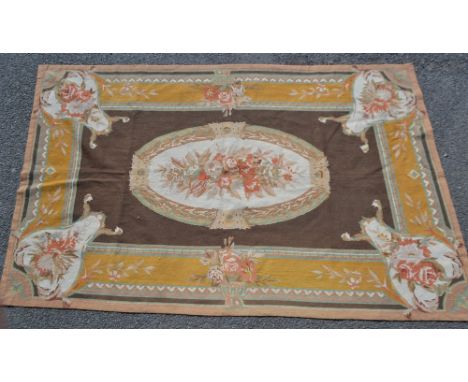 A woolwork, hand stitched table runner/carpet, in shades of green, ochre, brown and orange, 235cm x 150cm.