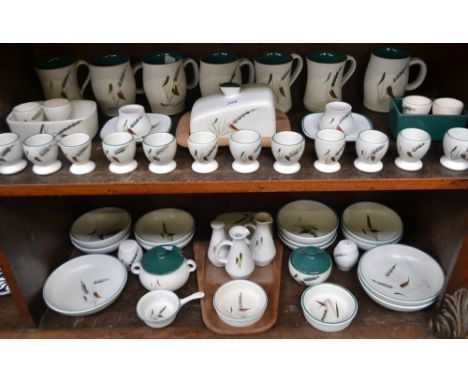 A Bourne Denby Greenwheat pattern cheese dish on treen stand, fruit and soup bowls, cruet sets, oil and vinegar bottles, egg 