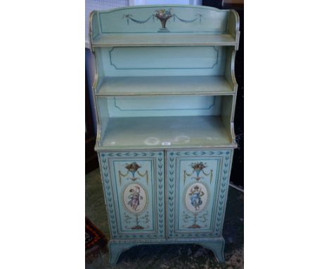 A 19th century painted waterfall bookcase/cabinet, three quarter gallery above three graduated shelves, the base with a pair 