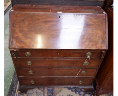 A 19th century mahogany bureau, fall front enclosing a central small door flanked by secret compartments and an arrangement o