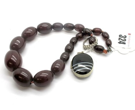 A Cherry Amber Coloured Bead Necklace, of short graduated design; together with a XIX Century banded agate locket pendant, an