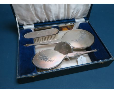 A Hallmarked Silver Mounted Four Piece Dressing Table Set, HCD, Birmingham 1962, each engine turned with foliate highlights, 