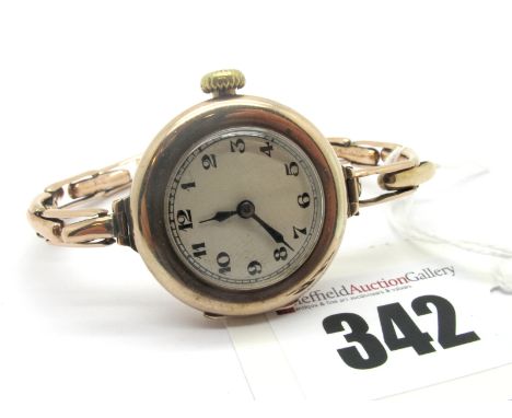 Rolex; A Vintage 9ct Gold Cased Ladies Wristwatch, the unsigned dial with black Arabic numerals, within plain case, on expand