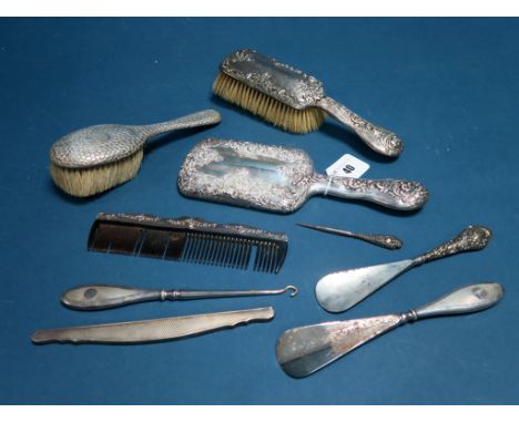 A Hallmarked Silver Backed Brush and Hand Mirror, (damages); together with further brush, comb, comb mount, shoe horns, etc.