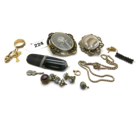 A XIX Century Oval Locket Brooch, the glazed panel encasing hair work; a banded agate brooch, star pierced chain, XIX Century