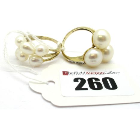 A 9ct Gold Three Pearl Dress Ring, with inset shoulders; Together with Another Modern Pearl Dress Ring. (2)