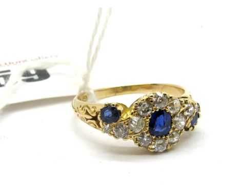 An 18ct Gold Sapphire and Diamond Set Cluster Ring, set throughout with old cut stones, Birmingham 1891. 