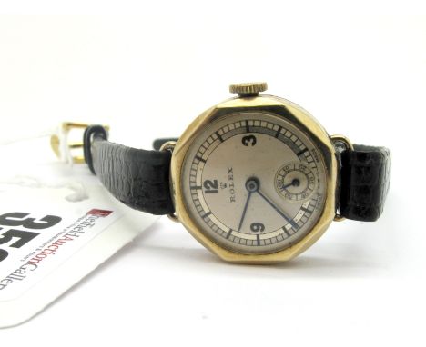 Rolex; A Vintage 9ct Gold Cased Ladies Wristwatch, the signed dial with part Arabic numerals and seconds subsidiary dial, wit