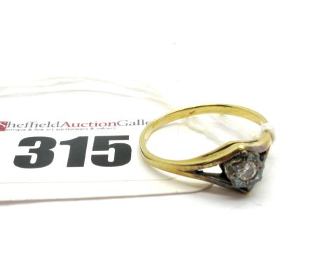 A Single Stone Diamond Ring, illusion set between bifurcated shoulders, stamped "18ct".