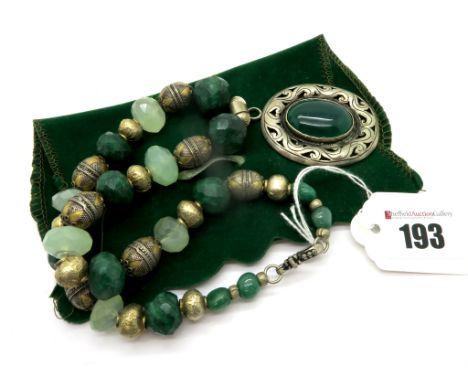 A Modern Faceted Bead Necklace, with gilt bead spacers, suspending large oval collet set panel pendant. 