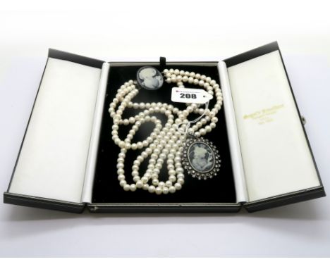 A Modern Three Row Fresh Water Pearl Bead Necklace, composed of uniform beads, to large oval black and white cameo style pane