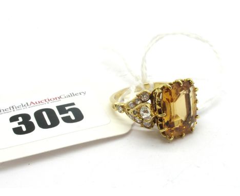 A Victorian Style Imperial Topaz and Diamond Set Ring, rectangular multi claw set to the centre, high between old cut diamond