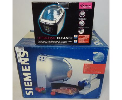 Siemens meat slice (This item is PAT tested - 5 day warranty from date of sale) and an ultrasonic jewellery cleaner  Conditio