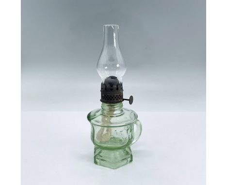 Small green glass oil lamp body including clear chimney with bronze colored hardware. Little Jewel embossed to body. Dimensio