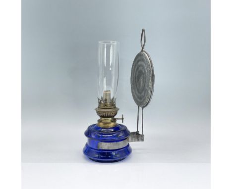Blue glass oil lamp body including clear chimney with bronze colored hardware. Wall hanging hardware attached to body. Dimens