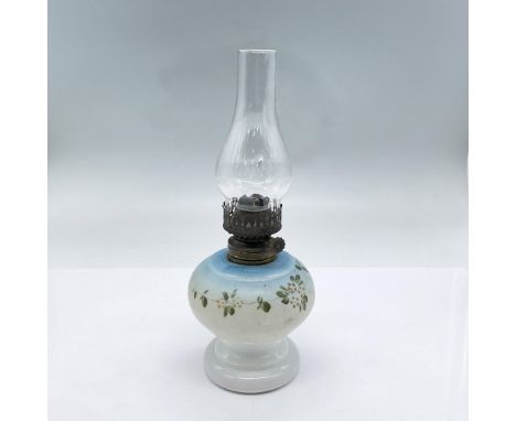 Oil lamp with clear glass chimney, white milk glass body with handpainted flowers and leaves, bronze hardware. Dimensions: 9.