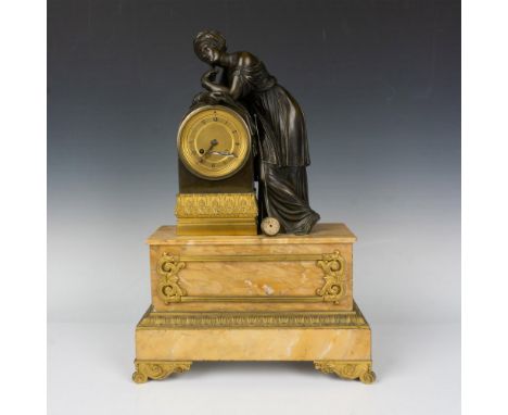 A luxurious and elegant Neoclassical patinated bronze standing woman leaning on the clock, standing on Sienna marble plinth. 