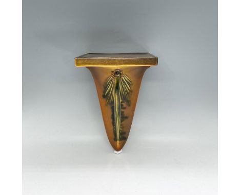 Earthenware wall shelf in shades of rust orange, brown and tan with a pine cone and leaves. Roseville mark. Dimensions: 9"H x