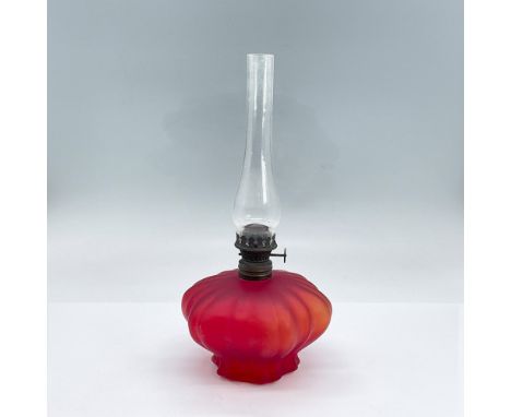 Red matte rippled glass oil lamp, clear chimney and bronze colored hardware. Dimensions: 9.5"H x 4.25" diaCondition: Age rela