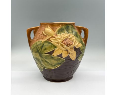 Earthenware planter in a honey brown color blending into chocolate brown with yellow flowers and green lily pads design in hi