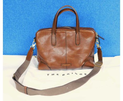 A tan leather tote bag by The Bridge, with top zip fastening with hand straps and detachable fabric shoulder strap, serial nu