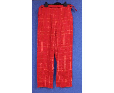 A pair of trousers by Bottega Veneta, the red check cotton trousers with adjustable buckle waistband and side fastenings  no 