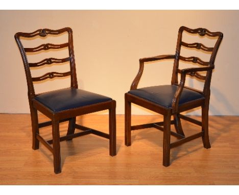 A set of 12 George III style mahogany ladder back chairs, including two carvers, 90cm high