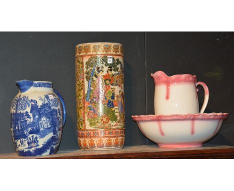 A pottery toilet ewer with matching basin, jug 30cm high, also with Chinese type pottery stick stand, and an ironstone willow