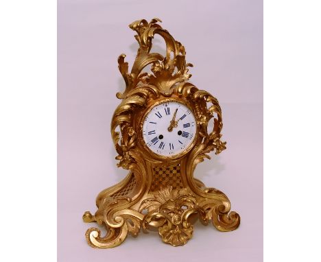 An antique French Ormolu type bracket clock in the Louis XV style, circa 19th century, the white enamel dial with Roman and A