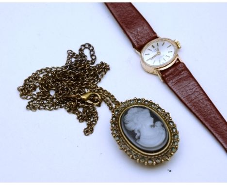A Rotary 9ct gold backed lady's wristwatch, the champagne dial with baton numerals, on brown leather strap, stamped 375 to ca