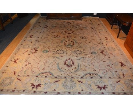 A large Afghan carpet, in classic Chobi design with allover foliate patterns in reds and greens on cream ground, 470cm x 338c