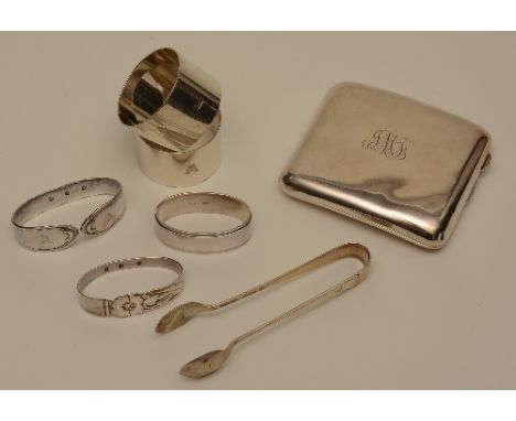 A mixed lot of silver items, comprising of silver cigarette case, five silver napkin rings, pair of sugar tongs, approx 7 ozt