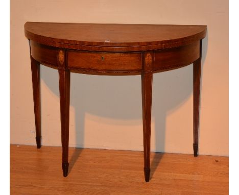 A George III demi-lune card table circa late 18th century, with fold over top, raised on tapering supports and spade feet, 76