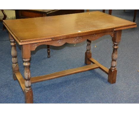 A light oak pull out dining table, 79cm high x 132cm long x 76cm wide