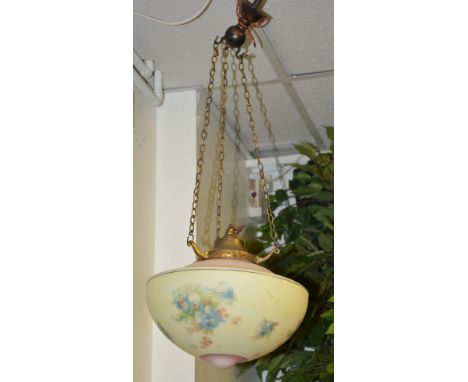 A vintage opaque glass ceiling light circa 1950's, decorated with floral panels on pink and yellow ground, with hanging chain