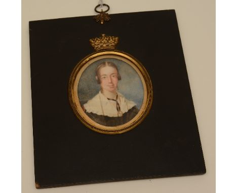 A portrait miniature watercolour on ivory of 'Lady in Black' circa 19th century, frame with crown motif, 6.5cm diameter