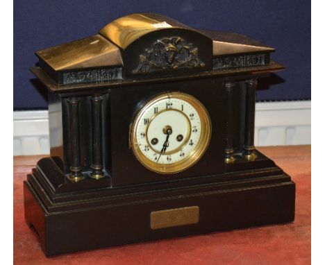 A Victorian black slate mantel clock, with cream enamel dial above presentation label, with key and pendulum, 30.5cm high