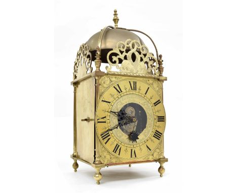 Good Cromwellian Eureka electric lantern clock, the 6.75" brass chapter ring enclosing a glazed centre with foliate engraved 