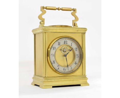 French ormolu travelling clock, the 3.25" silvered chapter ring enclosing a recessed centre with visible escapement, within a