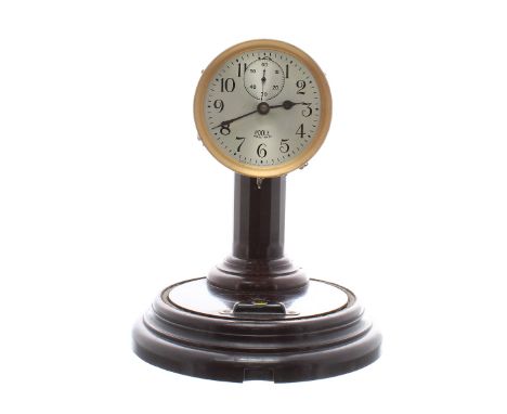 Early Poole Electric Clock Co. electric mantel clock, circa 1928, on round "Morsite" Bakelite base and pillar under a glass d