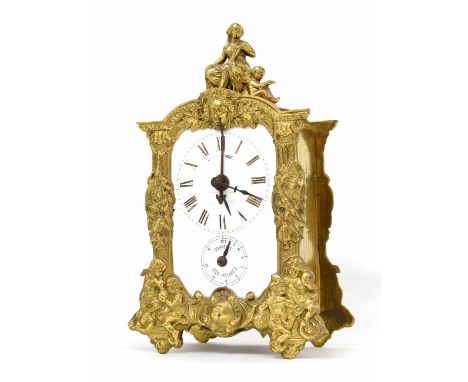 French brass mantel clock with alarm, the principal dial over an alarm dial and within an ornate case cast with cherubs and o