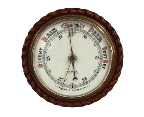 Circular wall aneroid barometer, the 10" white dial signed F.S. Reich, Folkestone, within a rope twist carved surround  