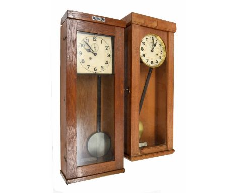 German electro-mechanical master wall clock, the 8.25" square cream dial with subsidiary seconds dial, within an oak glazed c
