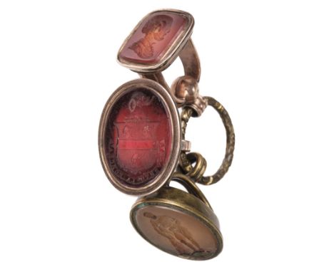 * Fobs. A George III gold plated fob, inset with a carnelian armorial intaglio of the Saunders Family, the shield surmounted 