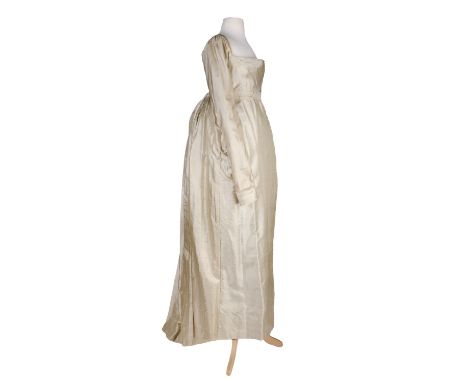 * Clothing. Wedding dress worn by Martha Spriggs, née Knight, 1813, hand-stitched cream silk high-waisted gown with short tra