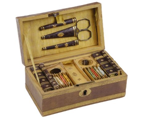 * Sewing Box. A Regency miniature sewing box, tan morocco-grained paper-covered wooden box with embossed gold trim, the inter