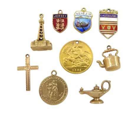 Six 9ct gold charms including kettle, Blackpool tower, lamp, cross, two enamel place name charms, 18ct enamel charm and an Ed